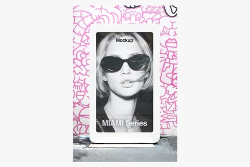 Mobile phone mockup with pink graffiti frame displaying black portrait image with sunglasses