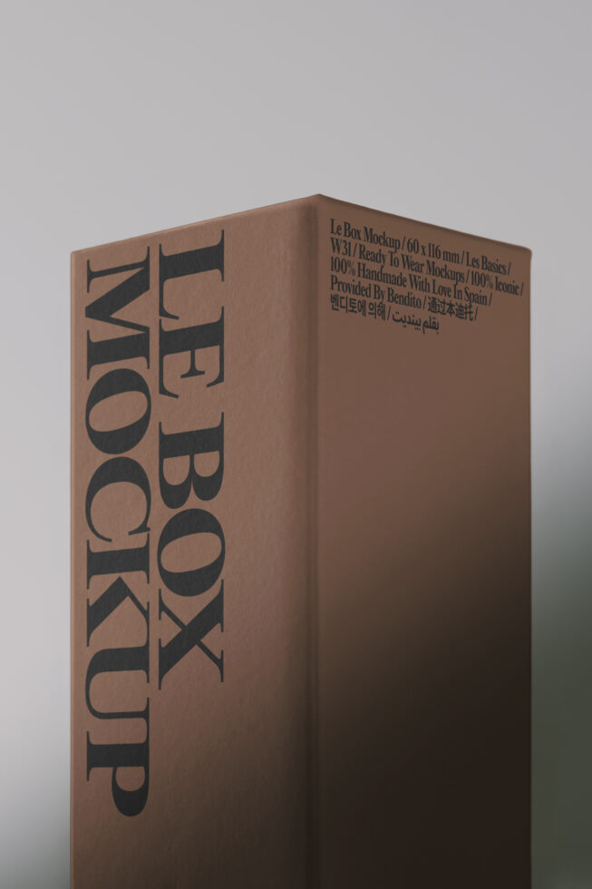 Kraft box mockup with bold serif typography on angled front corner, multilingual text visible