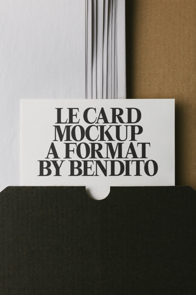 Minimalist business card mockup with serif typography on cream cardstock, black envelope backdrop