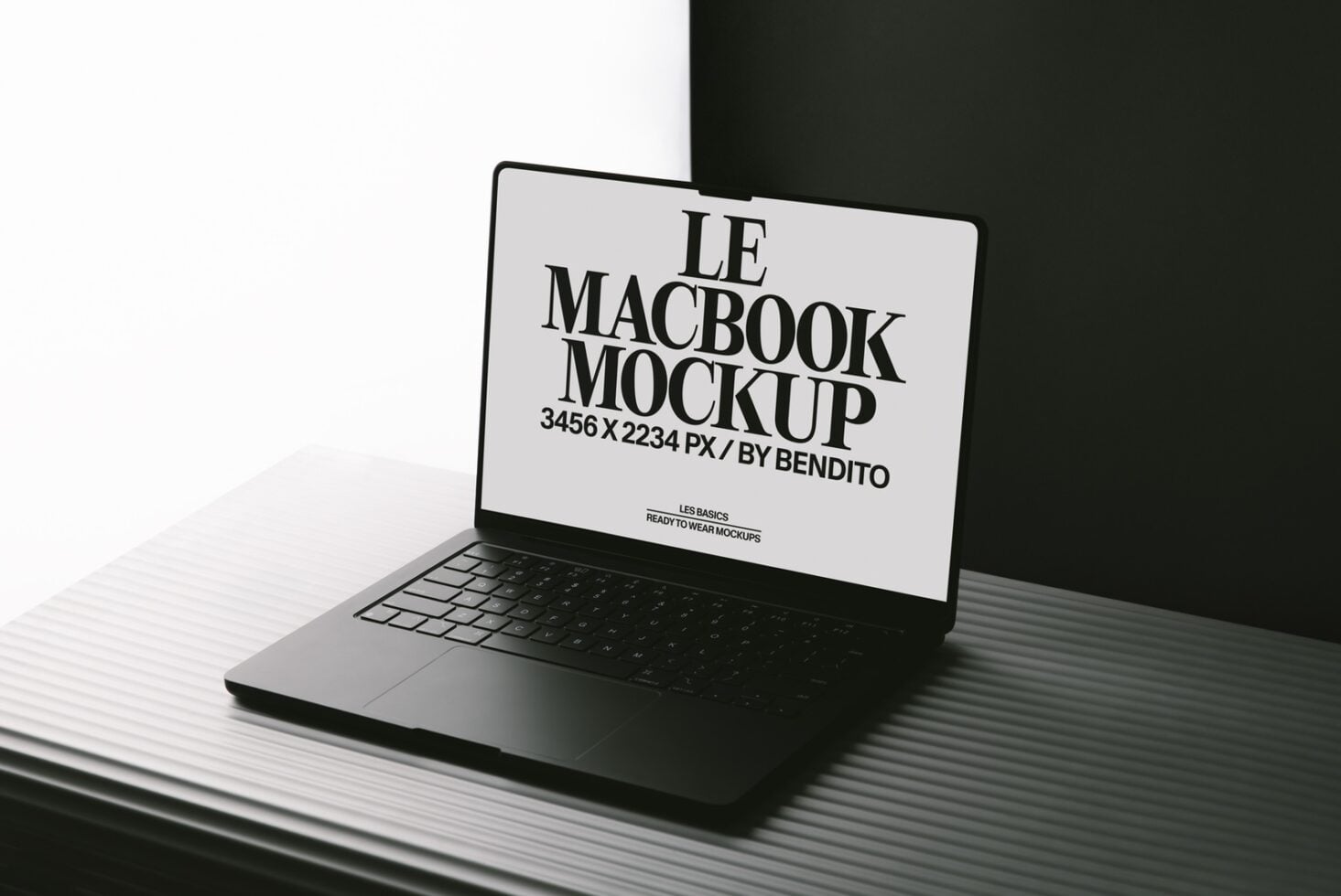 MacBook mockup shot from angle showing screen with customizable display area on dark backdrop