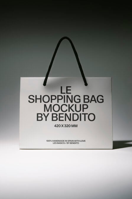 White shopping bag mockup with black rope handles, 420x320mm size displayed on neutral background