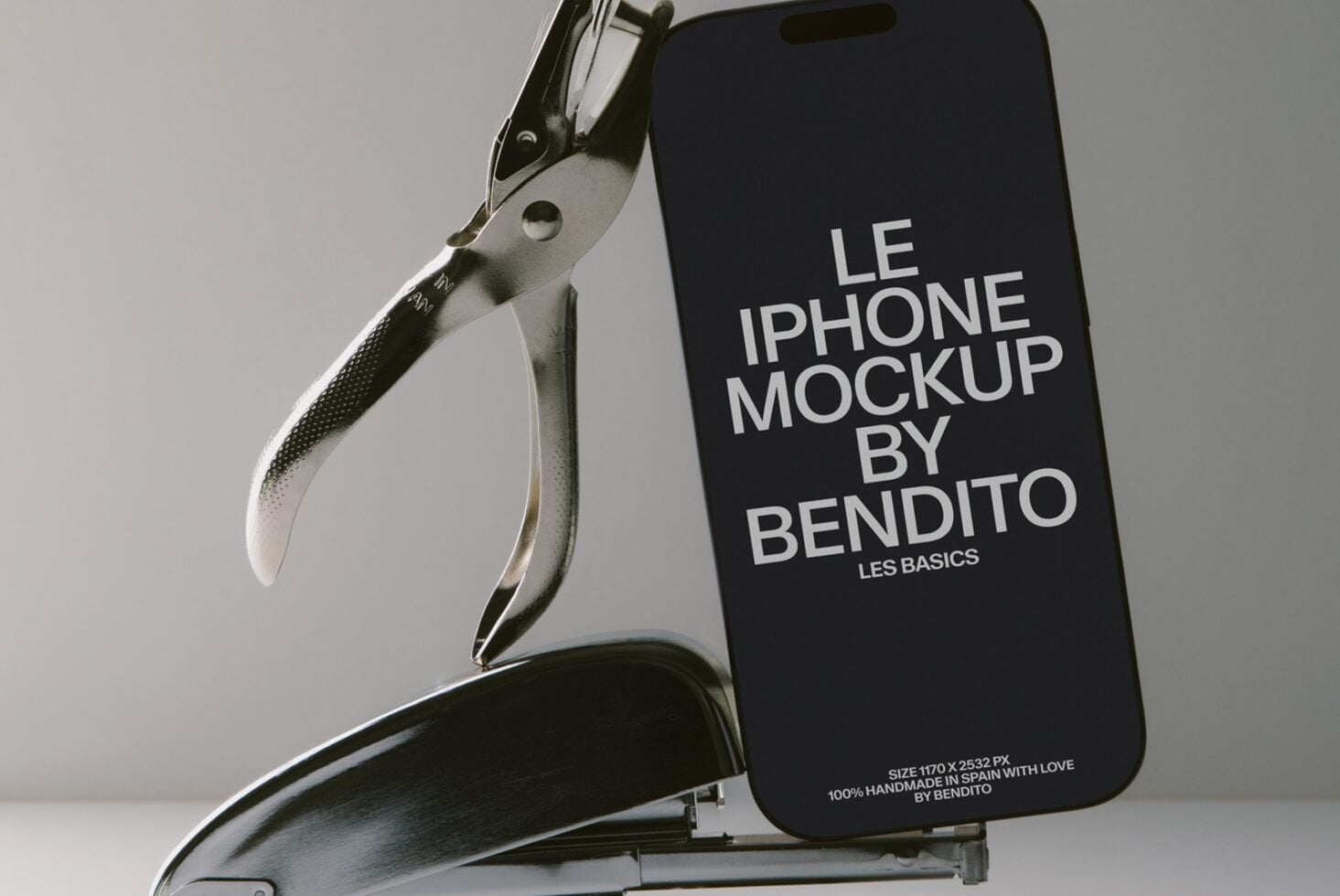 iPhone held by metal clamp showing black screen with white typography text overlay