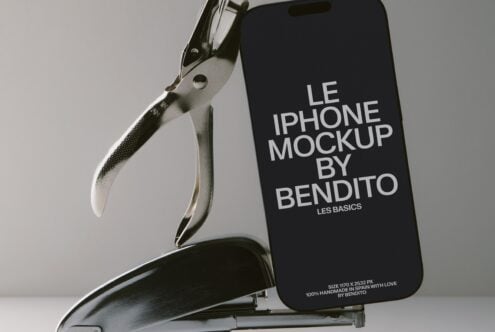 iPhone held by metal clamp showing black screen with white typography text overlay