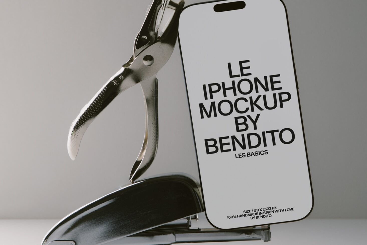 iPhone held by metal clamp showing screen with mockup text, neutral studio background