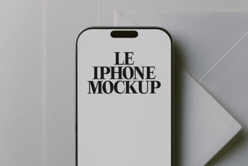 iPhone 14 Pro mockup with serif typography on clean white screen, minimal aesthetic setup