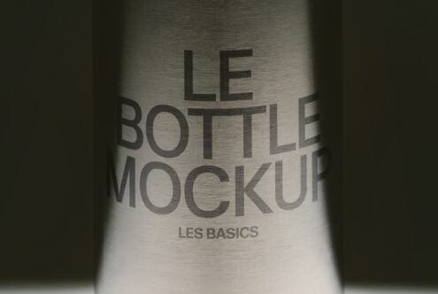 Metallic bottle with embossed text reading "Le Bottle Mockup" with "Les Basics" subtitle