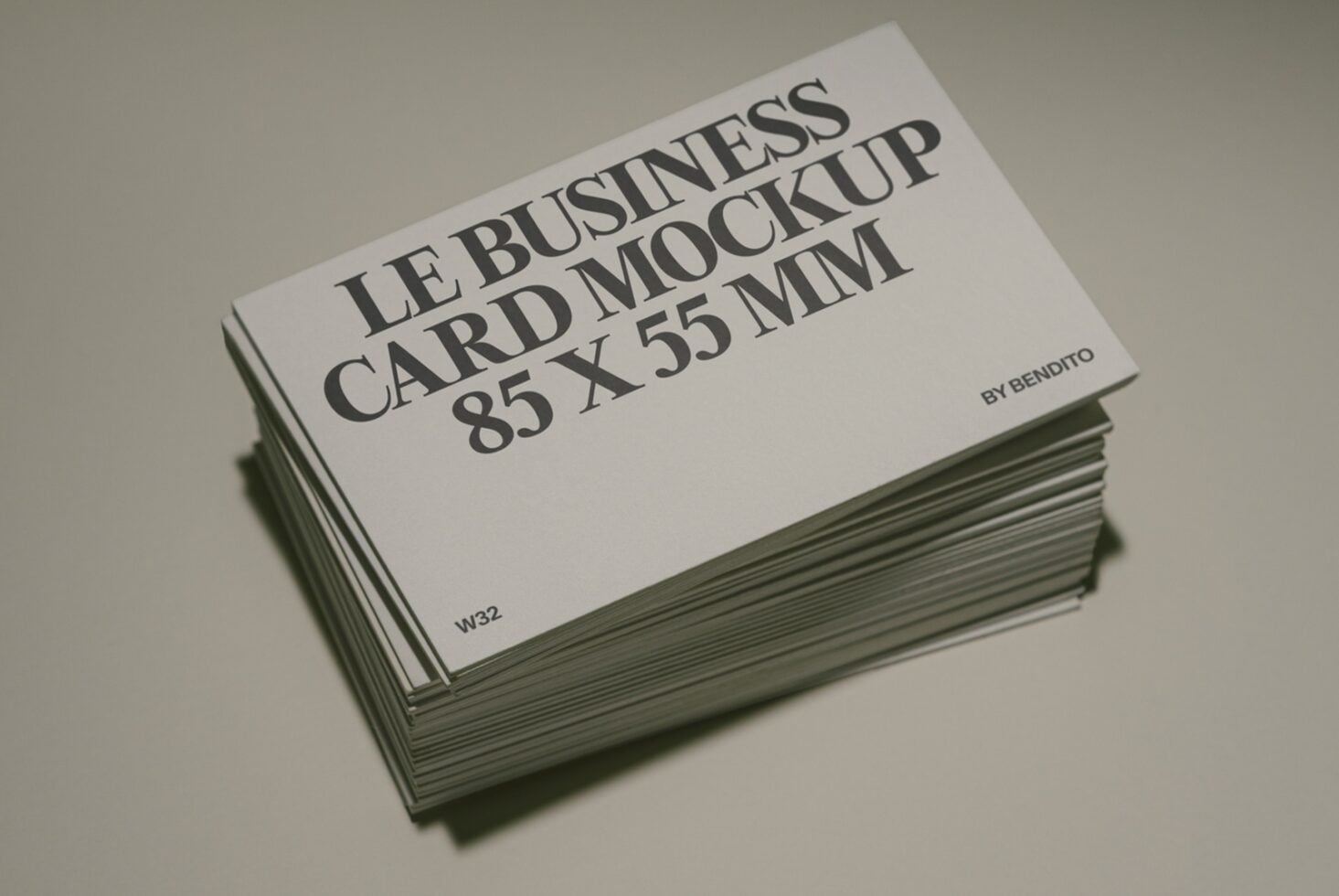 Stack of business cards 85x55mm mockup shot at angle showing front design