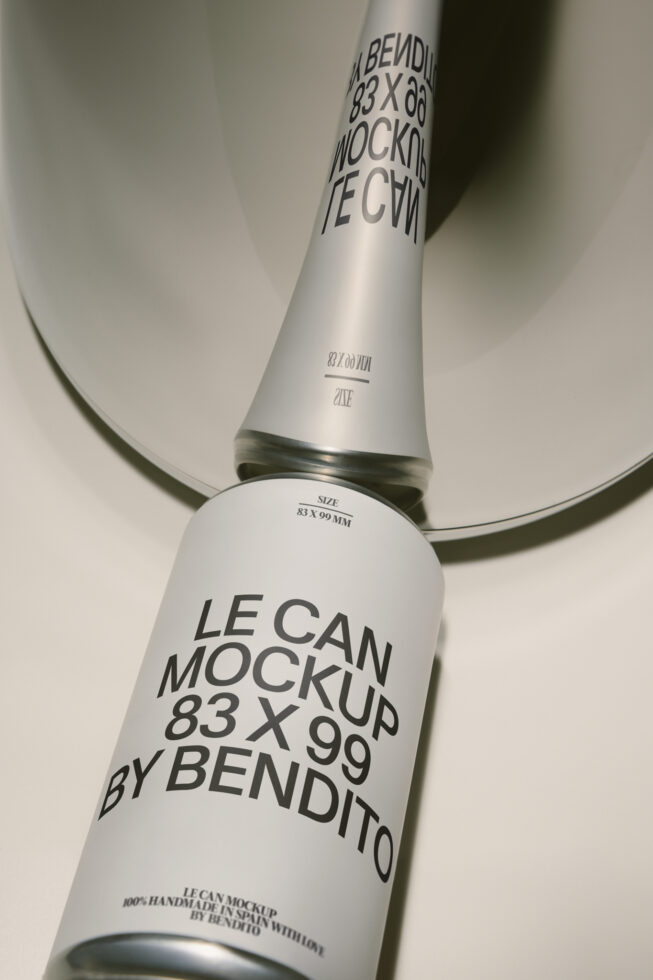 Sleek aluminum can mockup shot from above showing label placement on beverage packaging