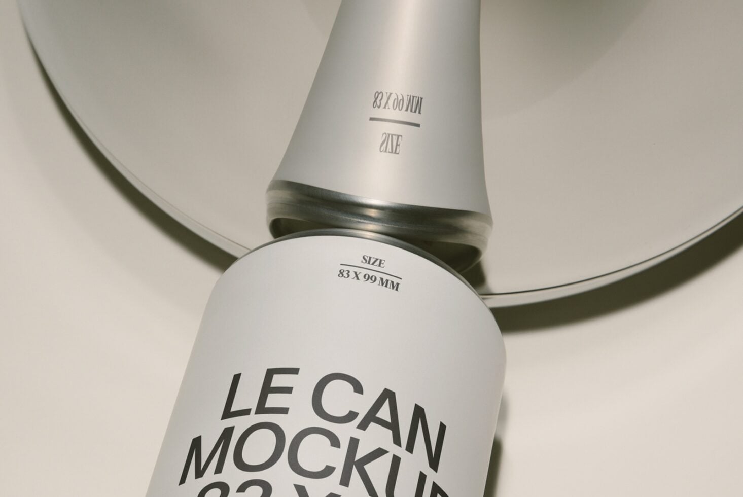 Cosmetic tube mockup shot from above showing label details on matte white container with metallic band