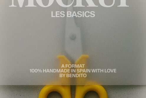 Bright yellow scissors cutting through design mockup with "Les Basics" typography overlaid on neutral background