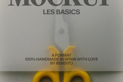 Bright yellow bag mockup leaning against concrete wall with Les Basics branding text overlay
