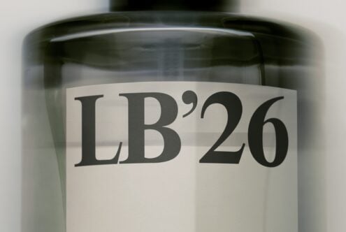 Cosmetic jar mockup with serif label reading LB'26 in bold black type
