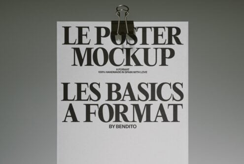 Cream poster with bold serif typography held up by a bottle clamp against olive background