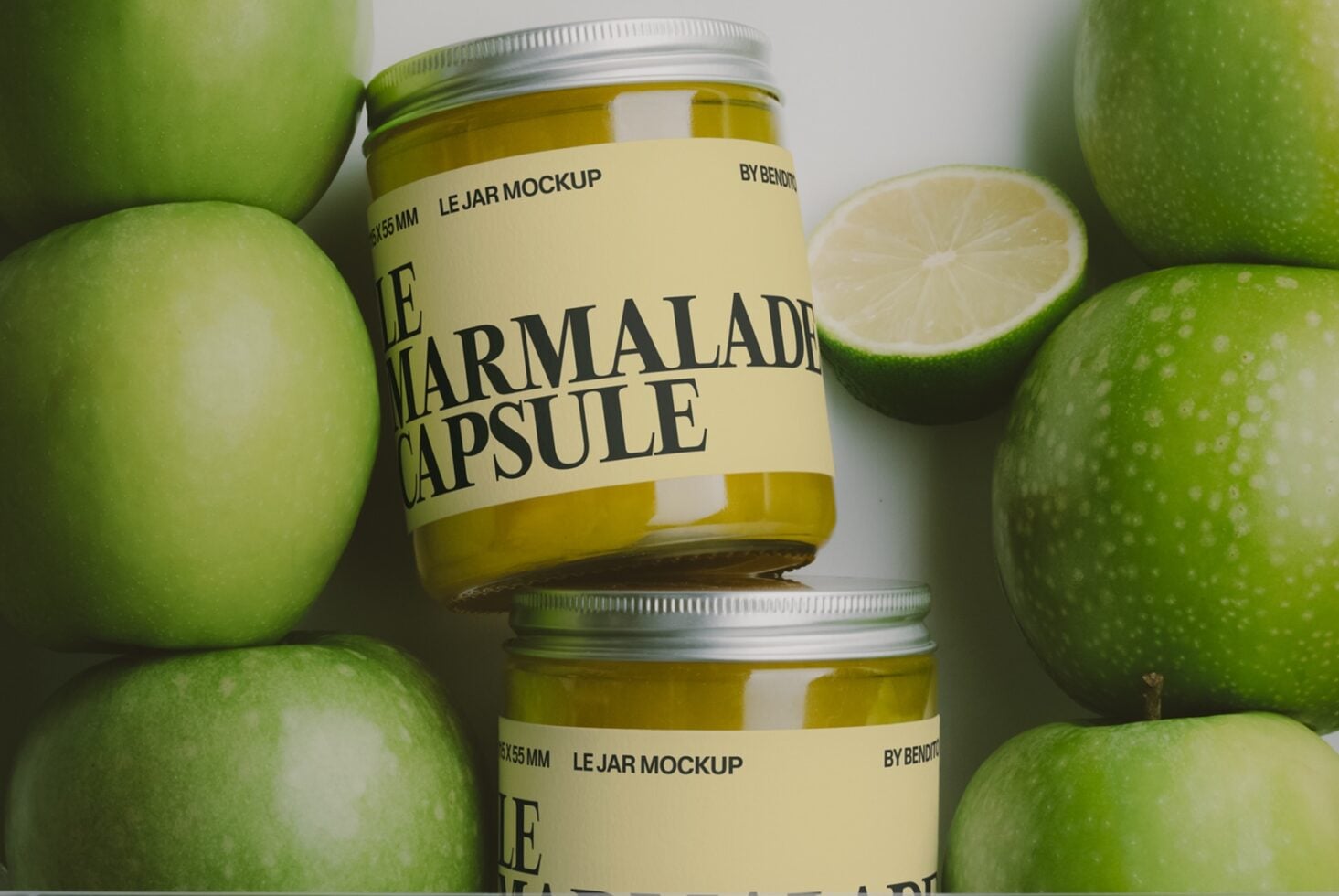 Jam jar mockup with lime green apples surrounding fresh citrus product packaging design
