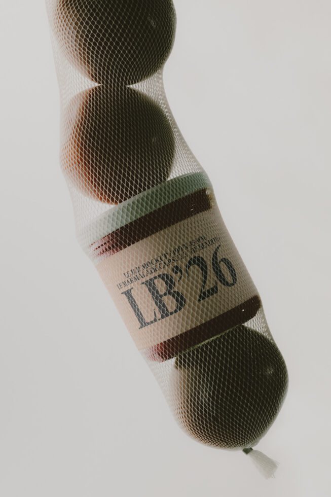 Wine bottle in mesh wrap with label showing through textured netting overlay