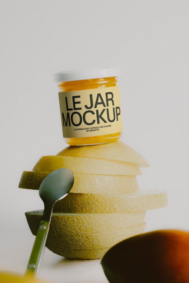 Jam jar mockup stacked with sliced melon, spoon, plus jam puddle below