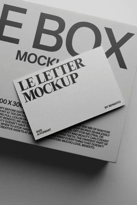 Folded letterhead mockup shot at an angle with bold typography in grayscale