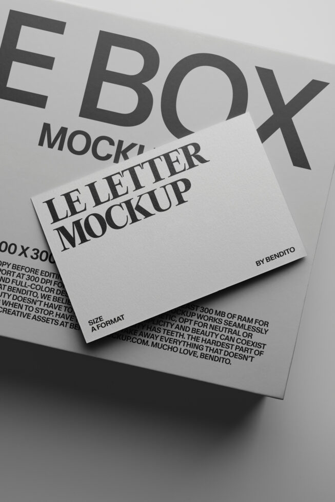 Folded letterhead mockup shot at an angle with bold typography in grayscale