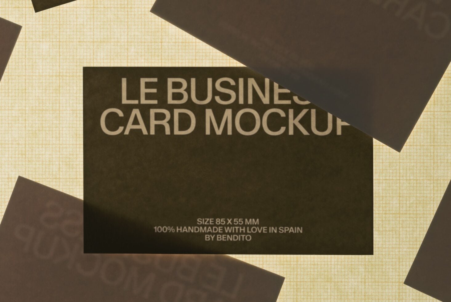 Charcoal business cards scattered on cream grid background with text overlay showing size specs