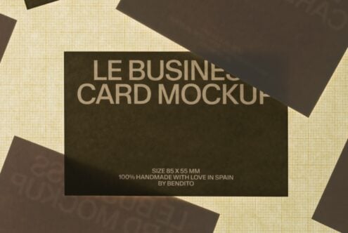 Charcoal business cards scattered on cream grid background with text overlay showing size specs