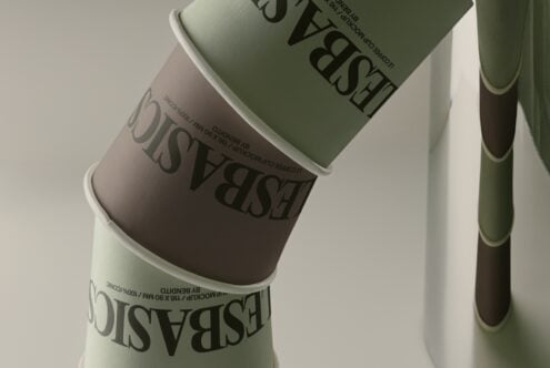 Stacked cosmetic jars in sage green with black serif typography on cream labels