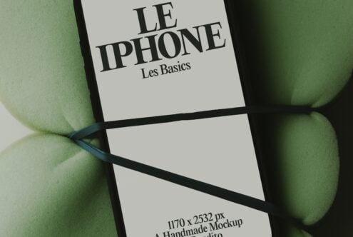 iPhone book cover mockup with French title on cream paper, black binding, surrounded by green apples