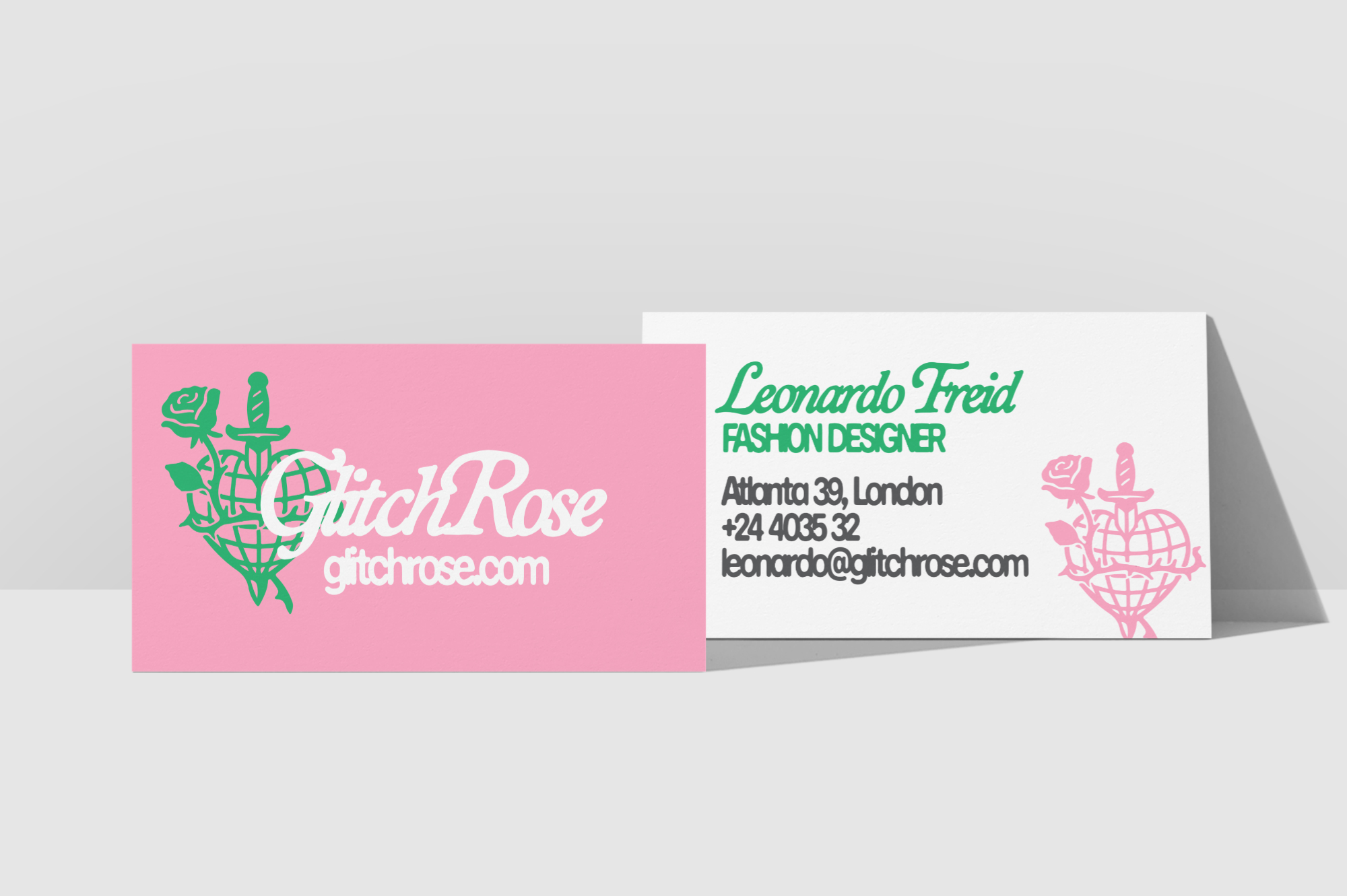 Folded business card mockup with pink rose logo design, green details, contact info on white side