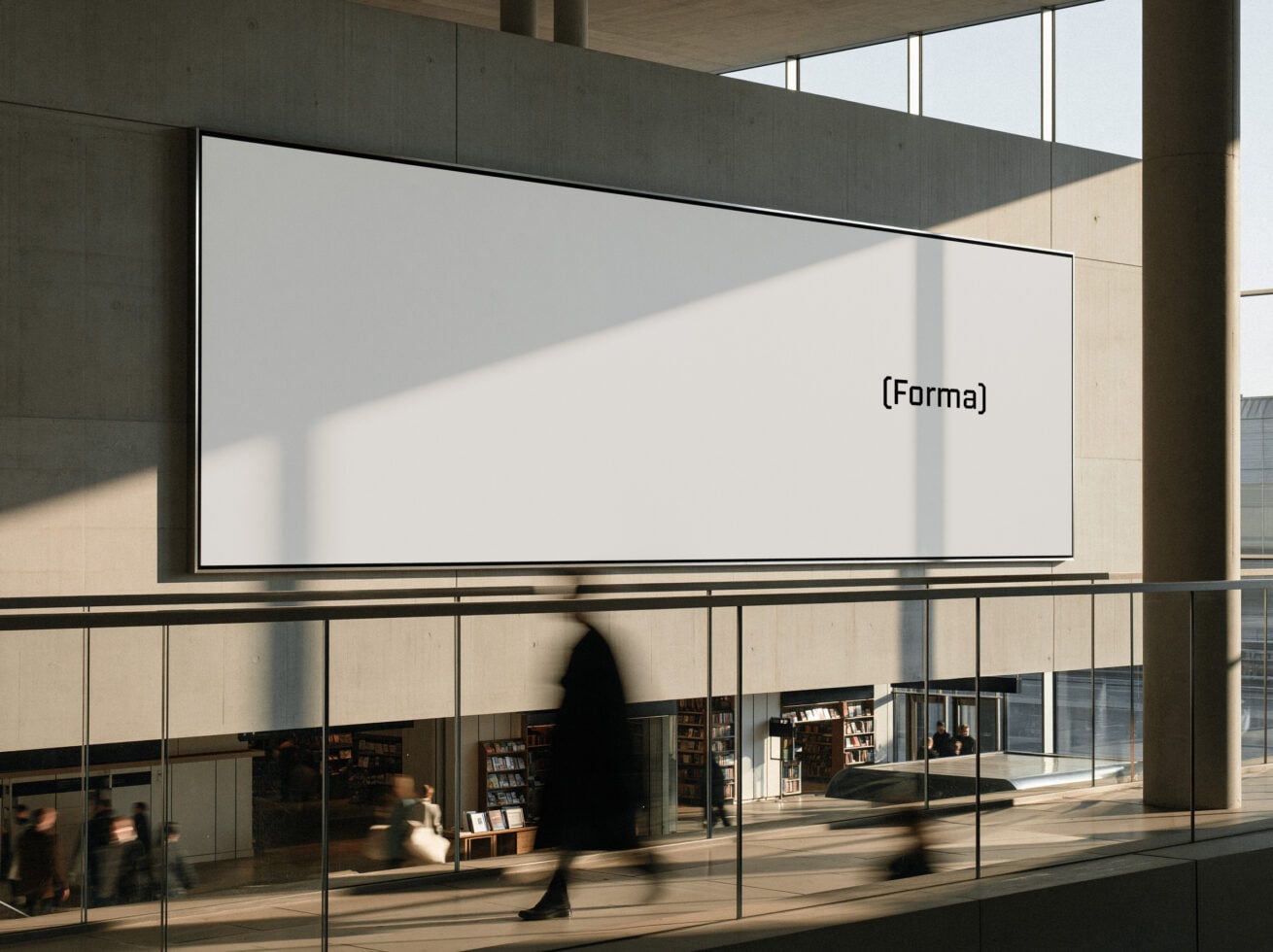 Blank billboard in modern concrete building with natural light casting shadows