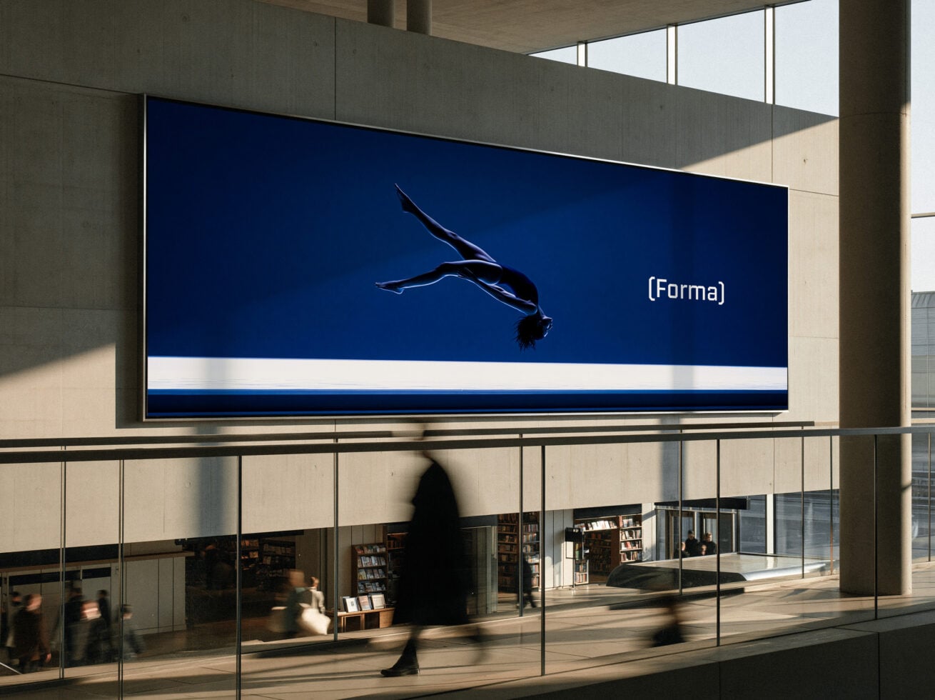 Billboard mockup showing deep blue screen with diver silhouette in modern architecture setting
