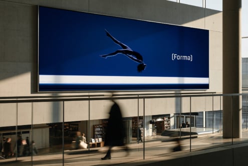Billboard mockup showing diver silhouette on deep blue background with Forma branding