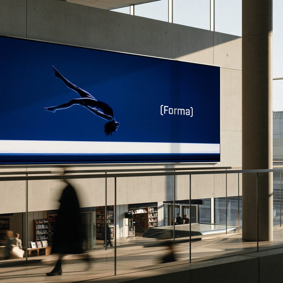 Large exterior billboard mockup on modern building with deep blue background, white text, silhouetted figure