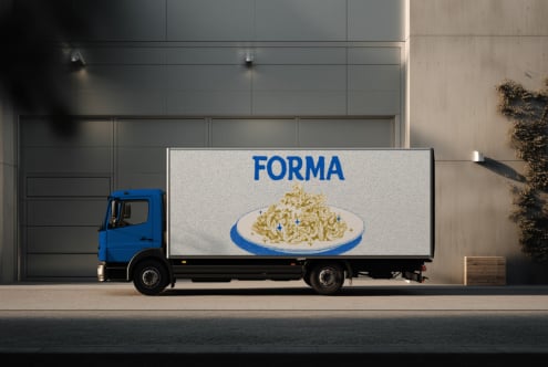 Delivery truck with blue pasta brand wrap showing pasta dish on side panel