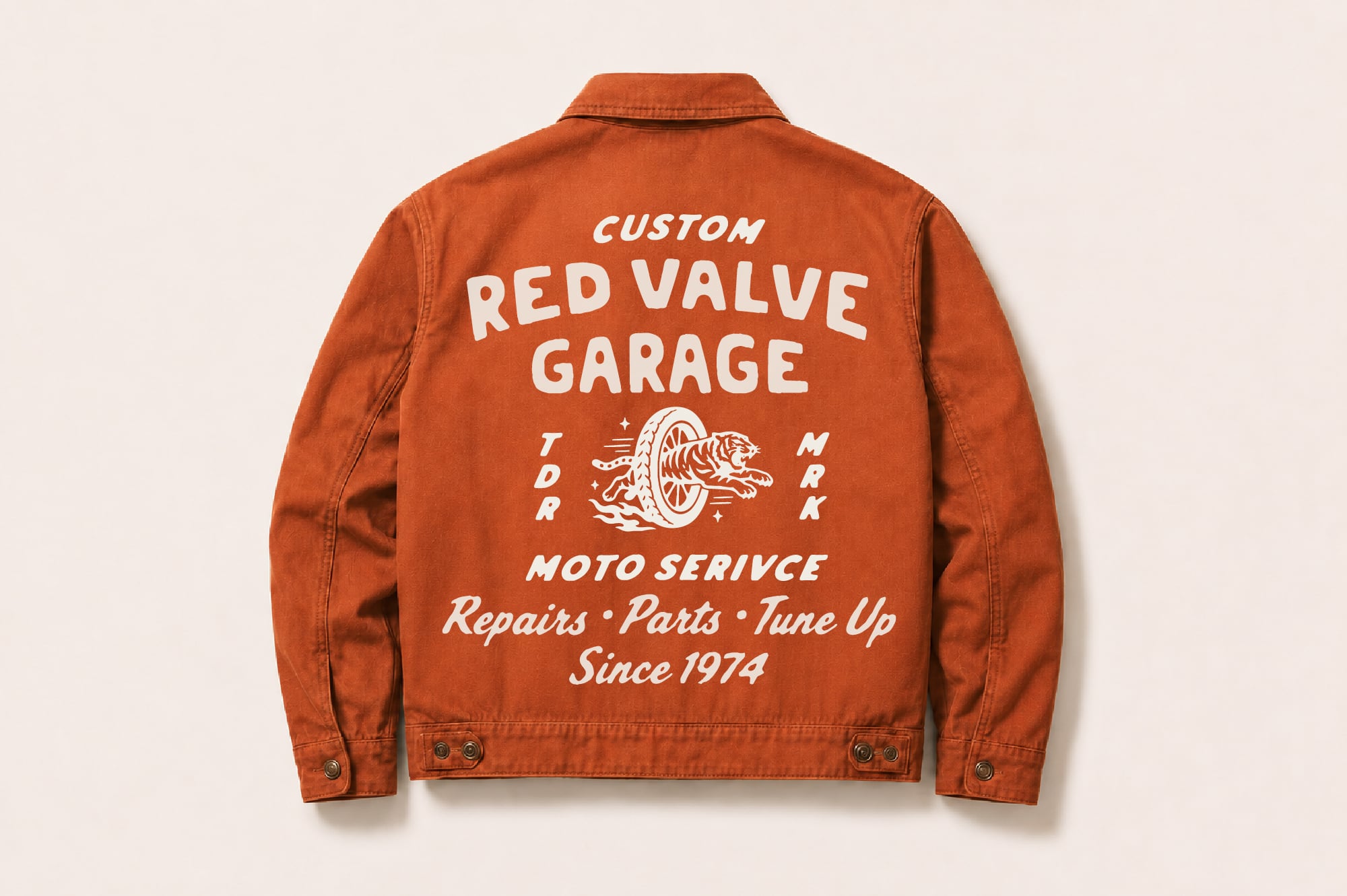 Rust denim jacket back with vintage garage print, motorcycle wheel graphic, retro service text