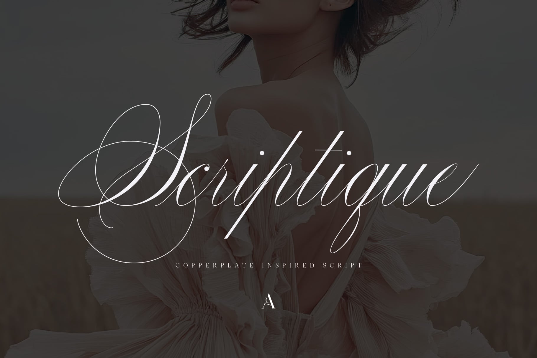 Elegantly script font layered over moody portrait with flowing fabric textures
