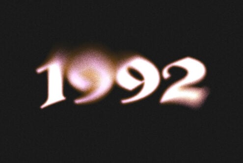 Glowing retro numbers 1992 with pink purple chromatic aberration on dark background