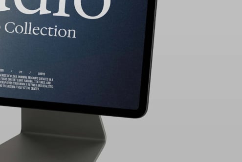 Desktop monitor displaying dark blue screen with "Collection" text, minimal typography mockup by Akoya
