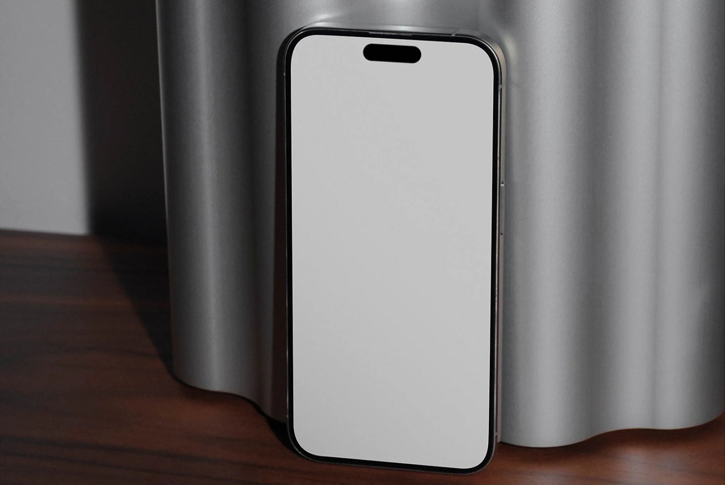 iPhone mockup with blank screen on wooden table, metallic backdrop