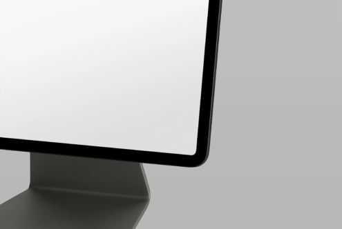 Desktop monitor mockup shot from above with blank white screen