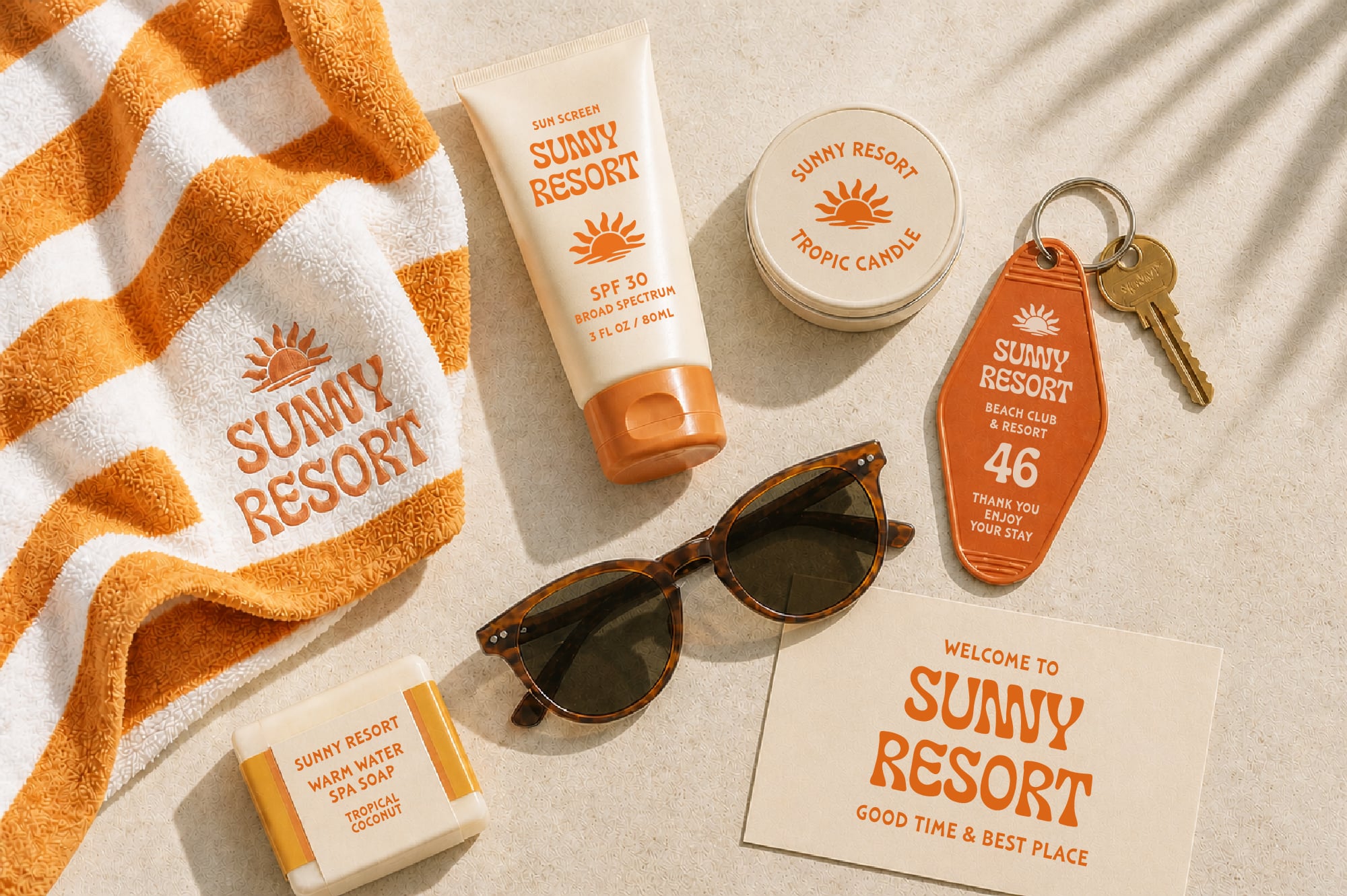 Sunny Resort branded beach product mockup with towel, sunscreen, candle, sunglasses, soap, keychain
