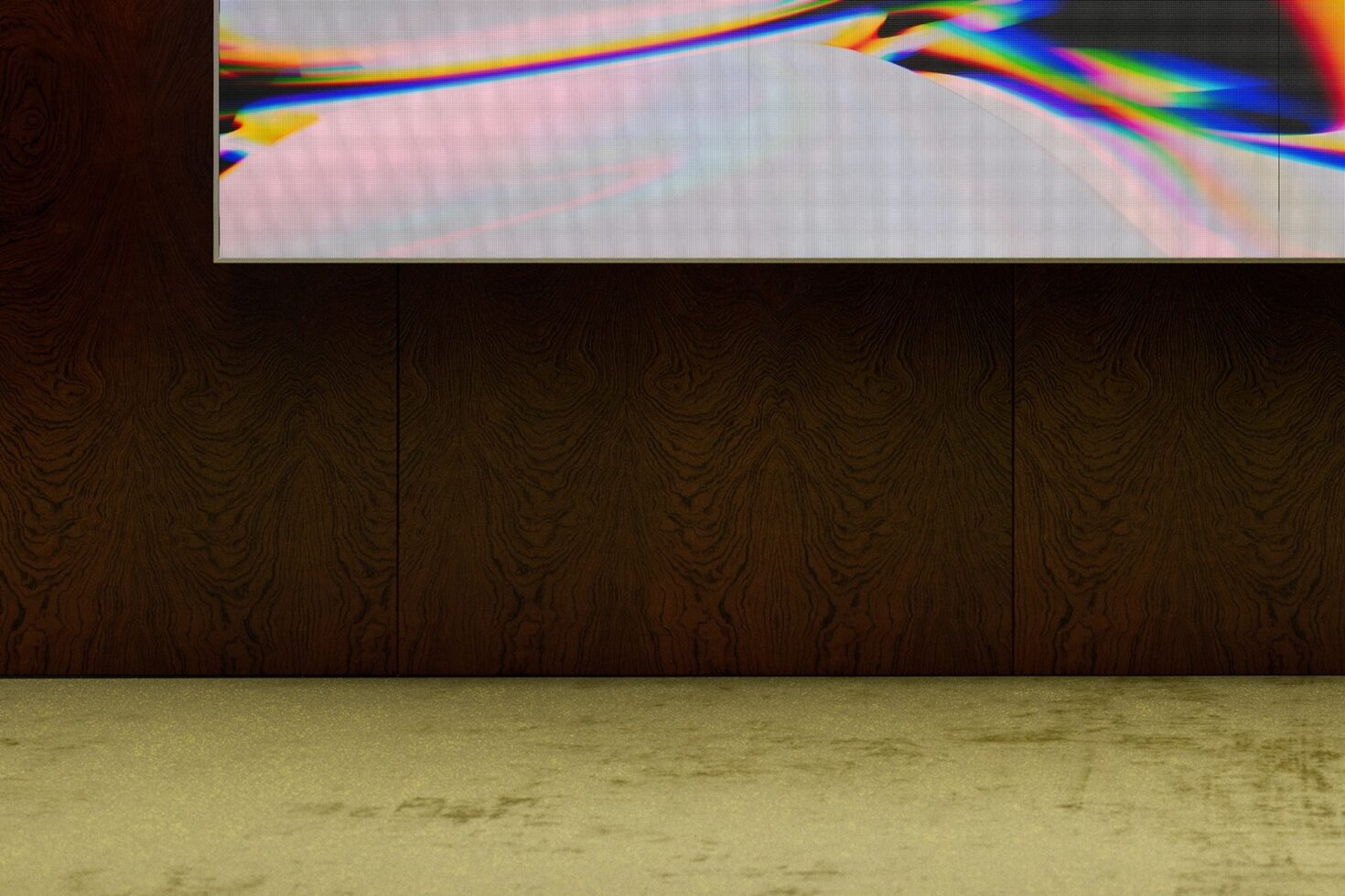 Horizontal monitor displaying vibrant chromatic aberration effect over minimal interior space