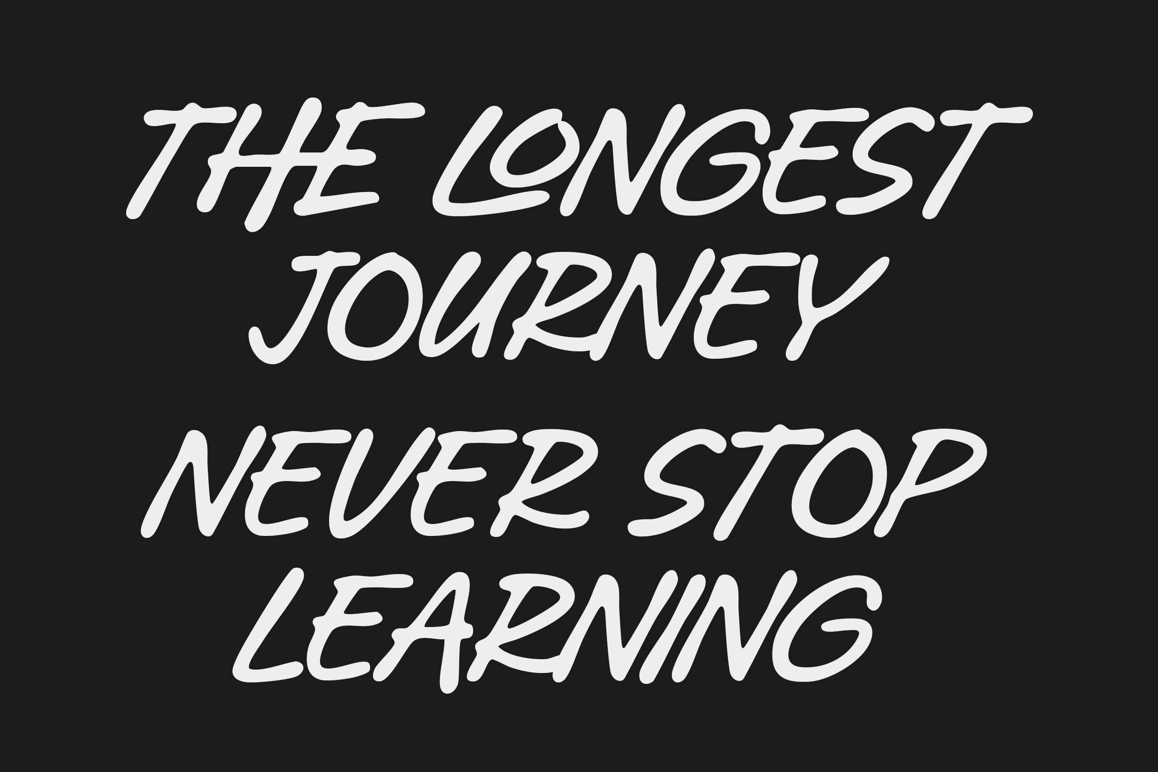 Handwritten italic text reading "the longest journey never stop learning" on dark background