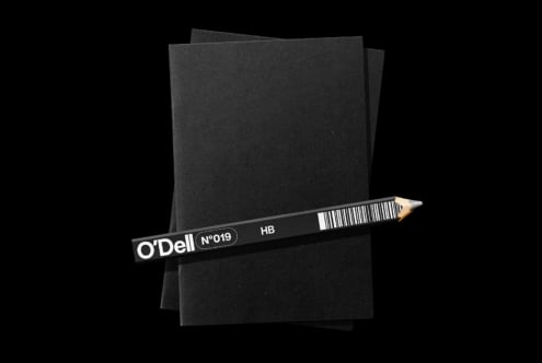 O'Dell pencil mockup with textured black paper sheets on dark background
