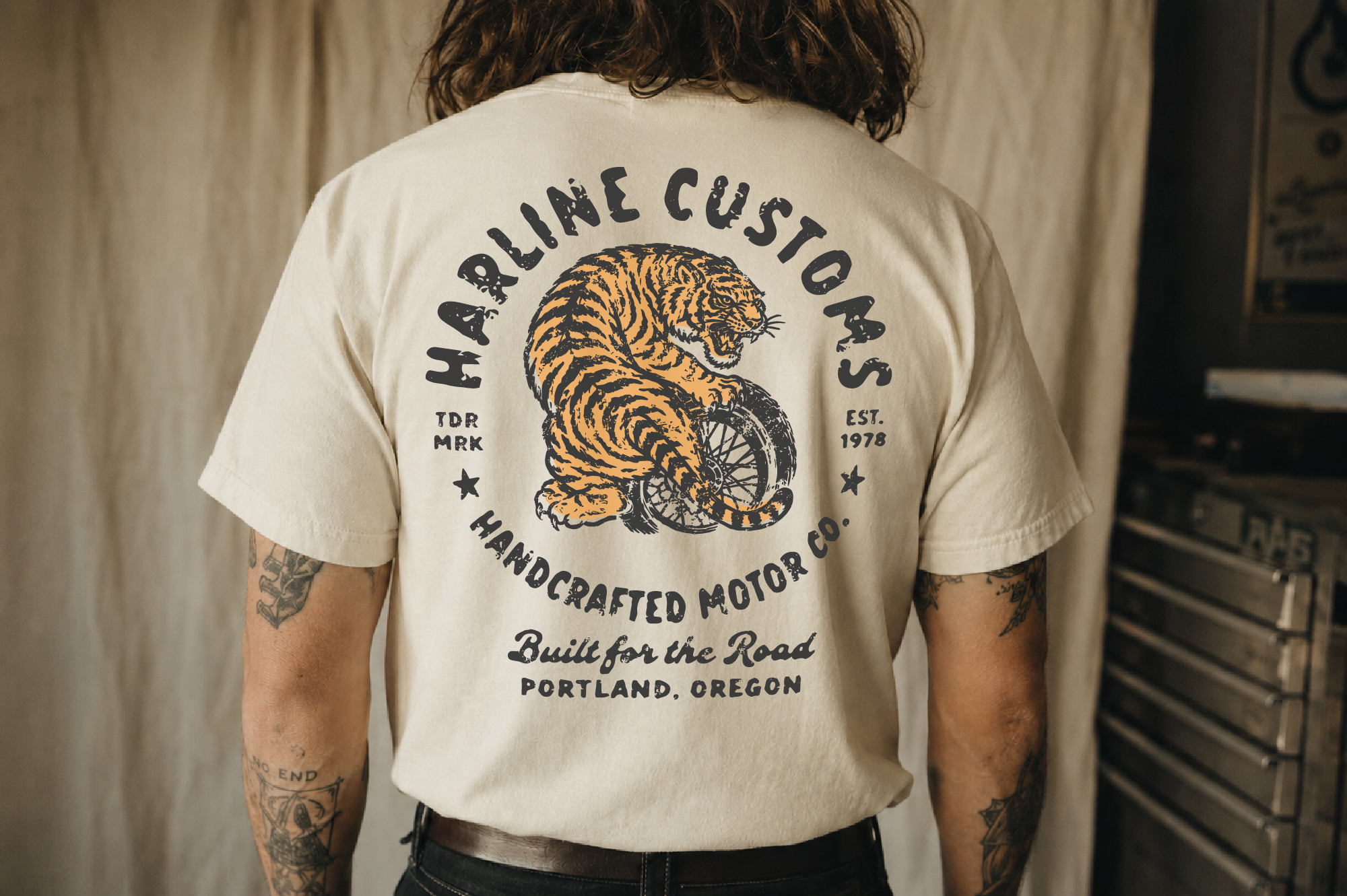 Cream tee back print with tiger on motorcycle wheel, vintage biker graphic design