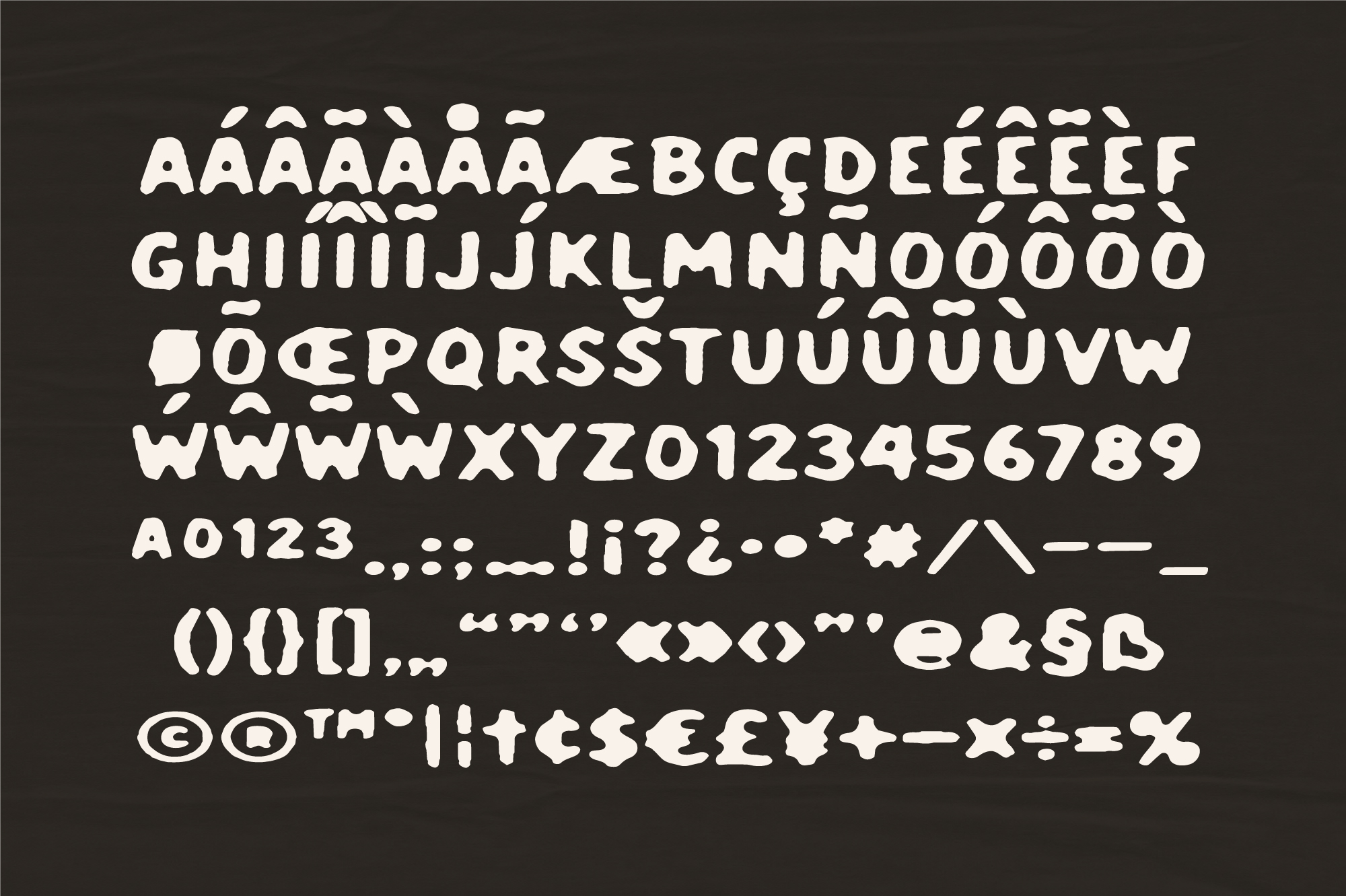 Chunky rounded sans serif font with accented characters, numbers, symbols on dark background