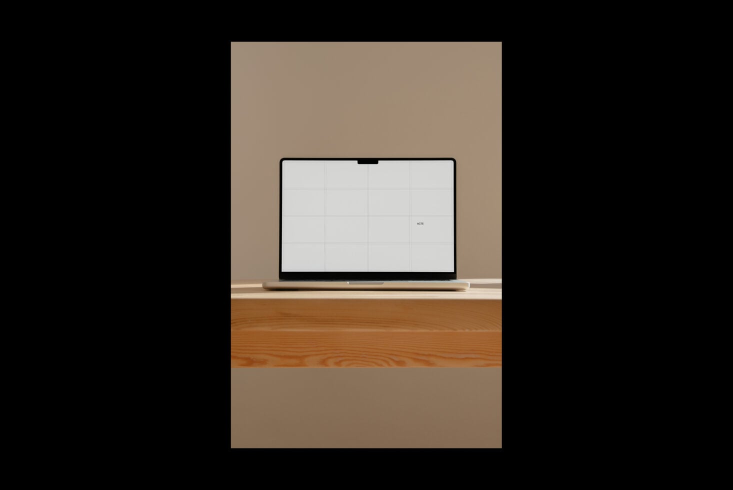Laptop mockup on wooden desk against beige wall with blank screen ready for designs