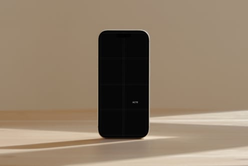 iPhone mockup with black screen on minimal beige background with natural shadows