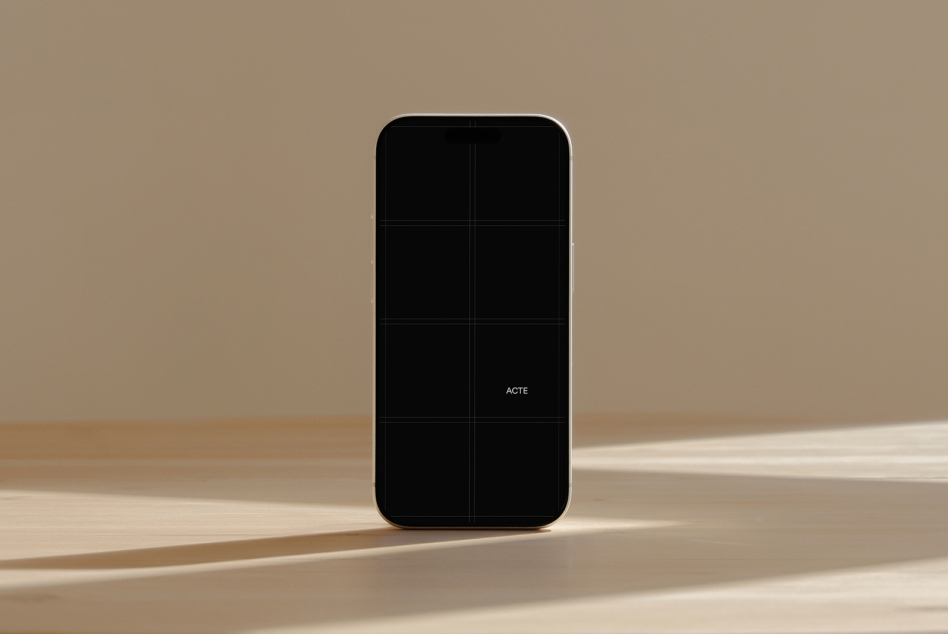 iPhone mockup with black screen on minimal beige background with natural shadows