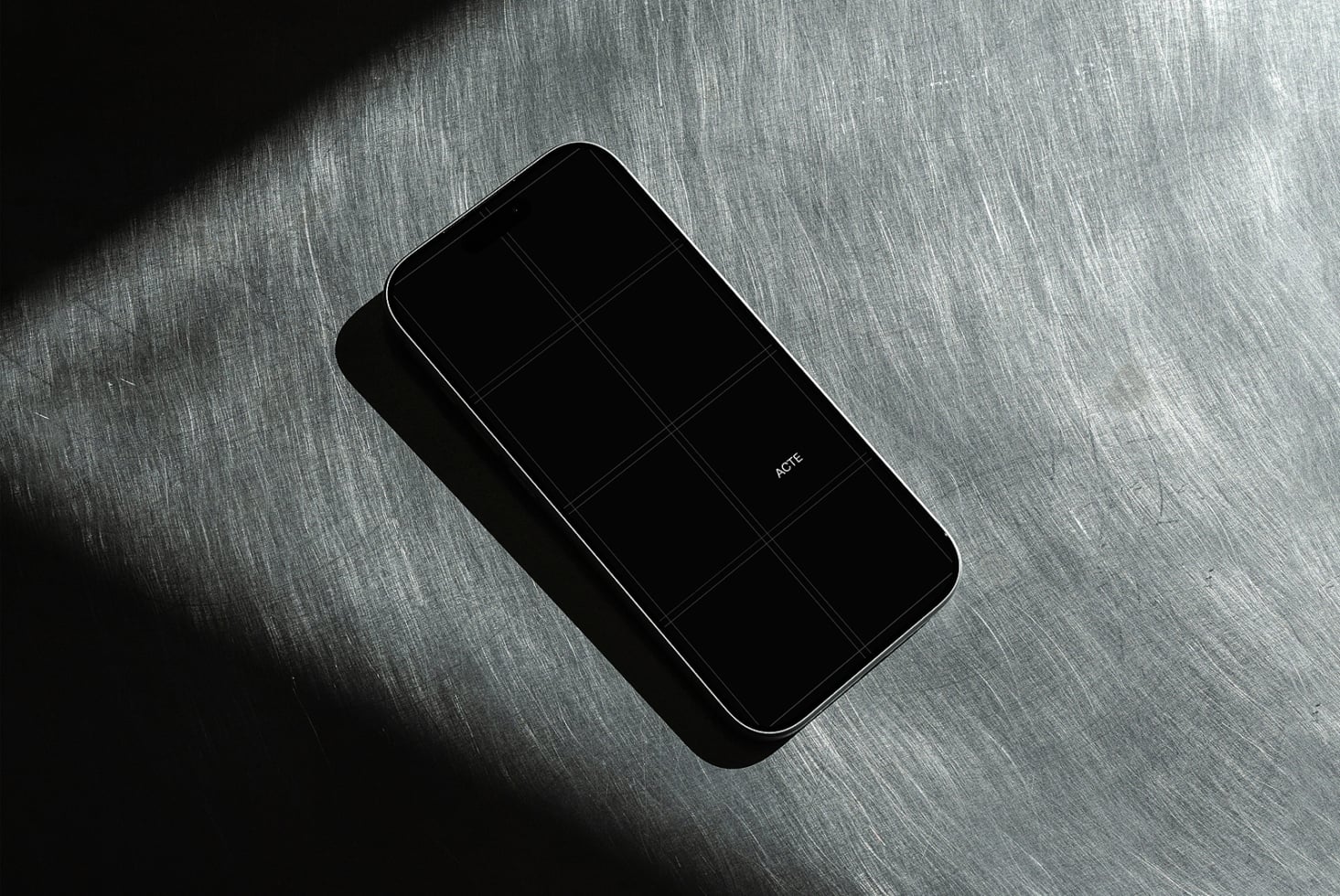 Sleek phone mockup with case on brushed metal surface, dramatic lighting