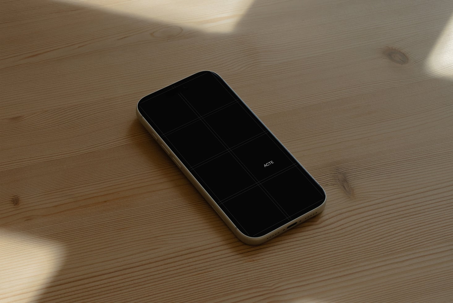 Cream smartphone mockup on wooden surface with natural sunlight casting shadows