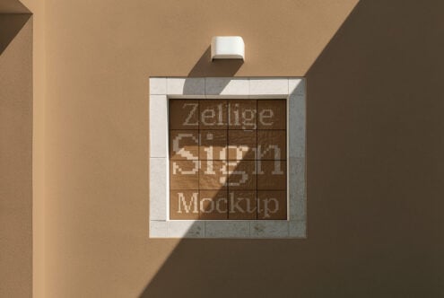 Square storefront sign mockup with pixel art design on textured wall with dramatic shadows